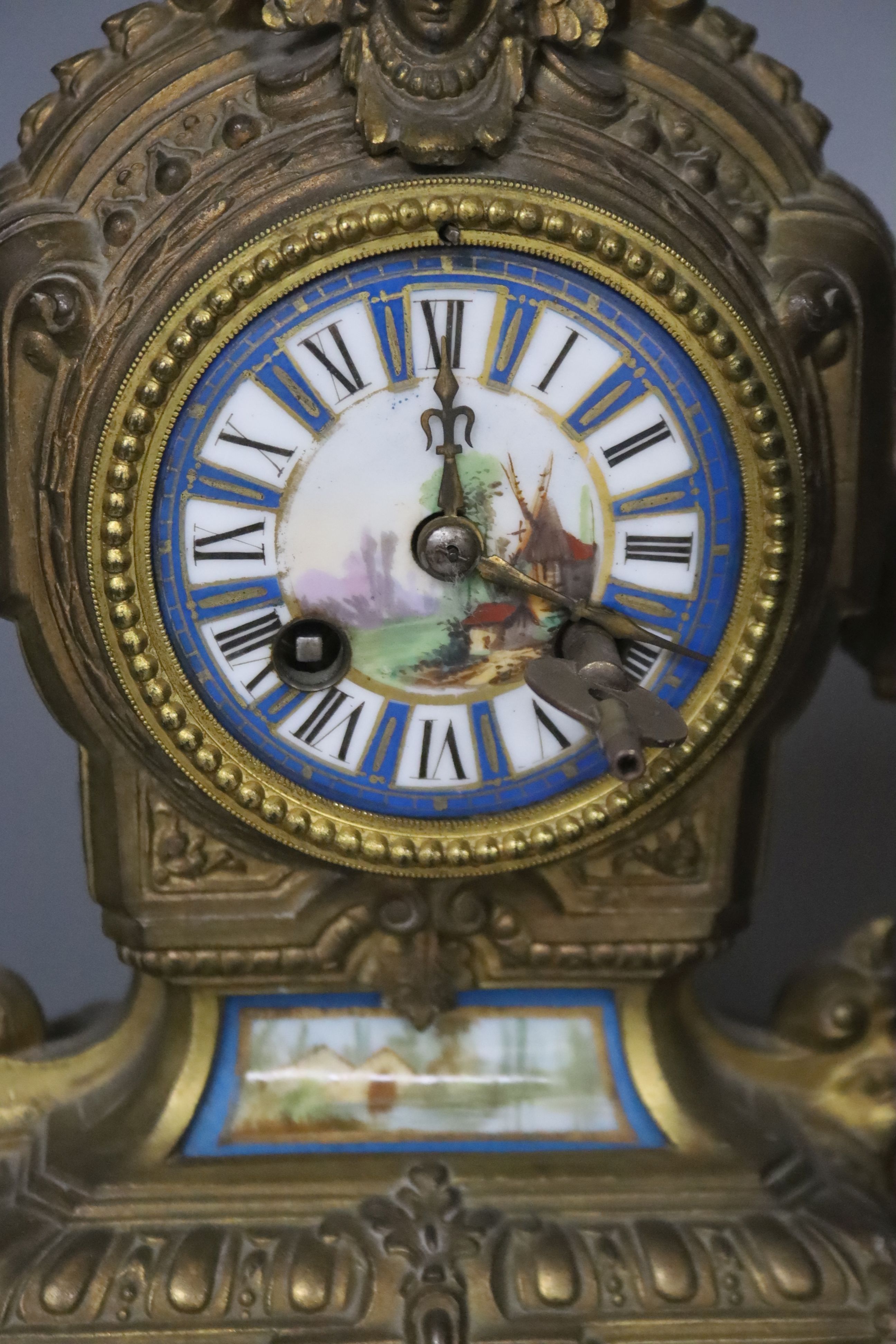 A 19th century French gilt metal and enamel mantel clock